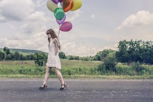 walking on road with balloons