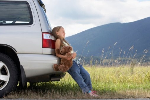 girl leaning on car