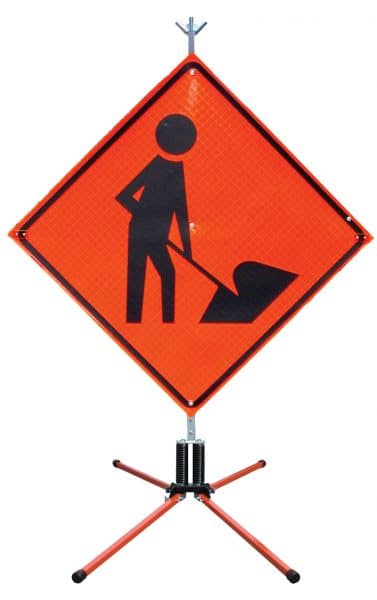 Crew working construction road sign 
