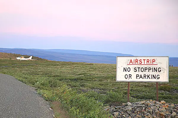 Airstrip no stopping or parking sign 