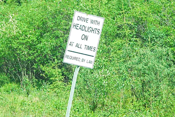 Drive with headlights on at all times road sign Canada 